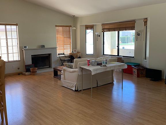Living Room with hardwood floors and fireplace. Lots of natural light.