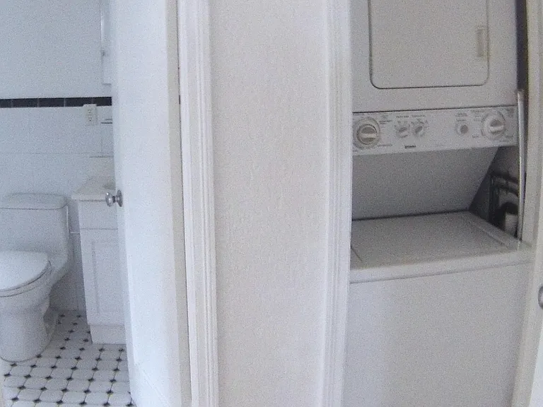 laundry located in unit hidden in closet