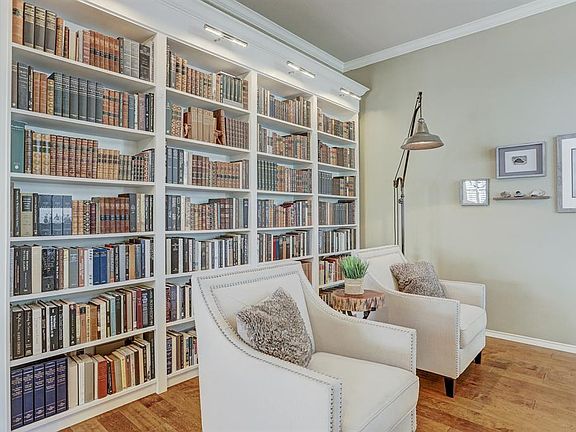 Built-in shelves with lights is a great addition to the study.