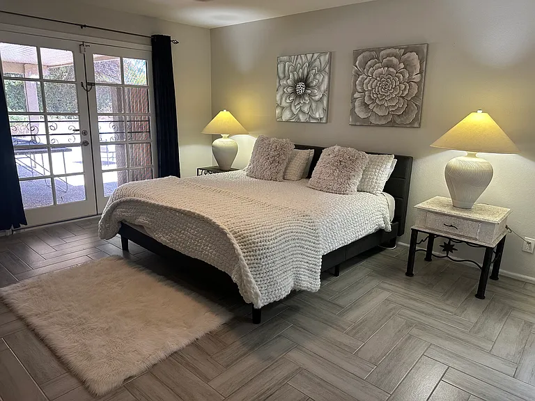 Master Bedroom with French Doors to the patio and pool area!