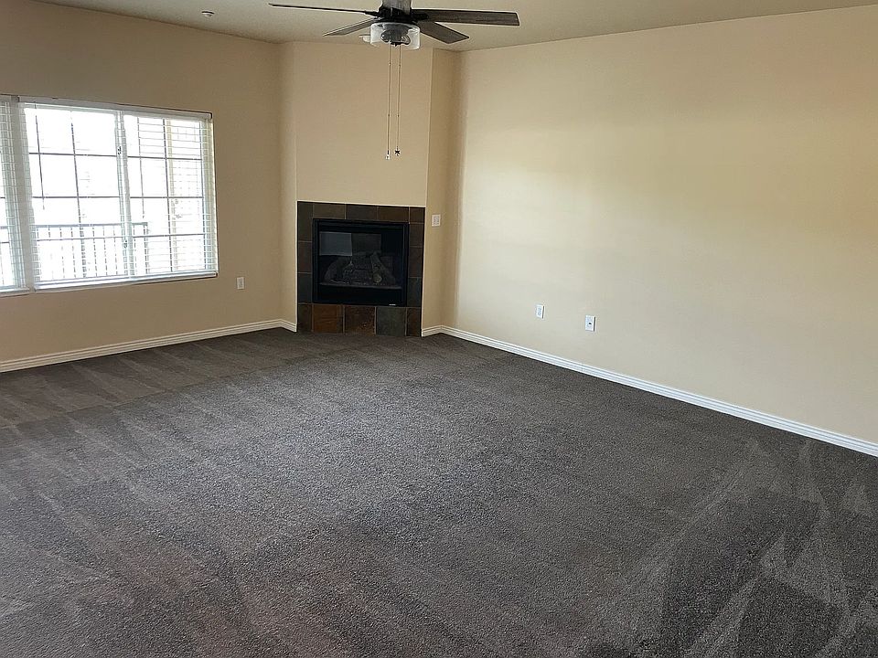 Living room with gas fireplace, no carpet wood floors now