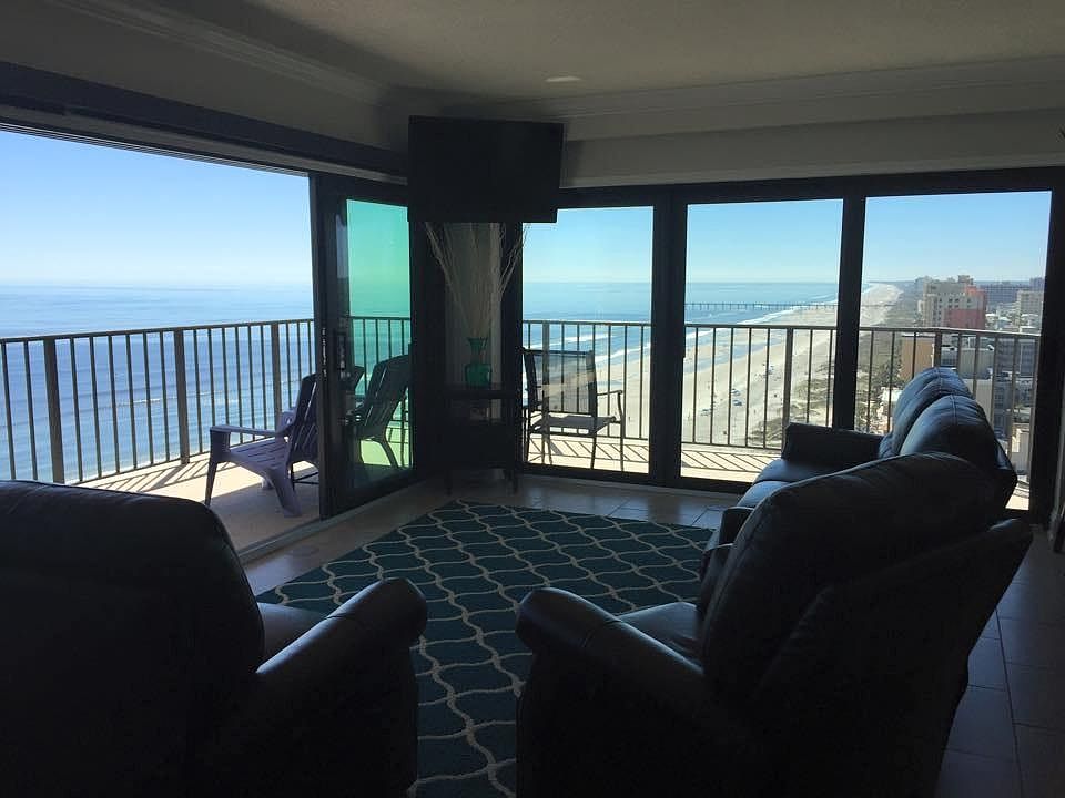 Sliding doors open to wrap around balcony