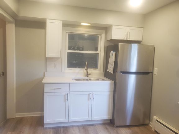 New refrigerator, cabinets and sink