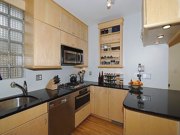 Renovated Kitchen with black granite counters