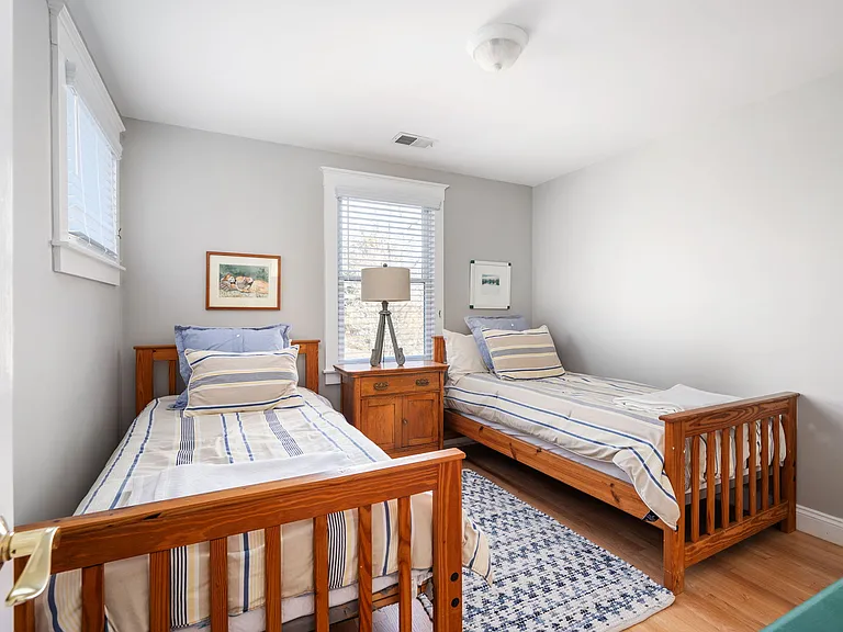 Upstairs left bedroom with twin beds and large closet.