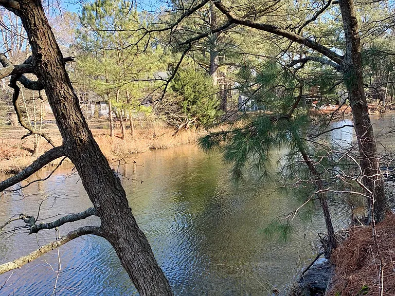 The lovely Assawoman Canal outside your back door at this special property.