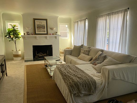This unit is unfurnished, but here's how serene it can look with coastal furnishings