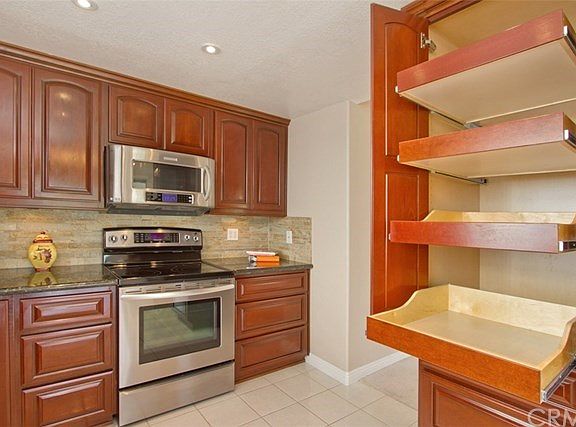 Convenient and Handy Pull out drawers.  Kitchen measures approx 12'5" x 9'6"