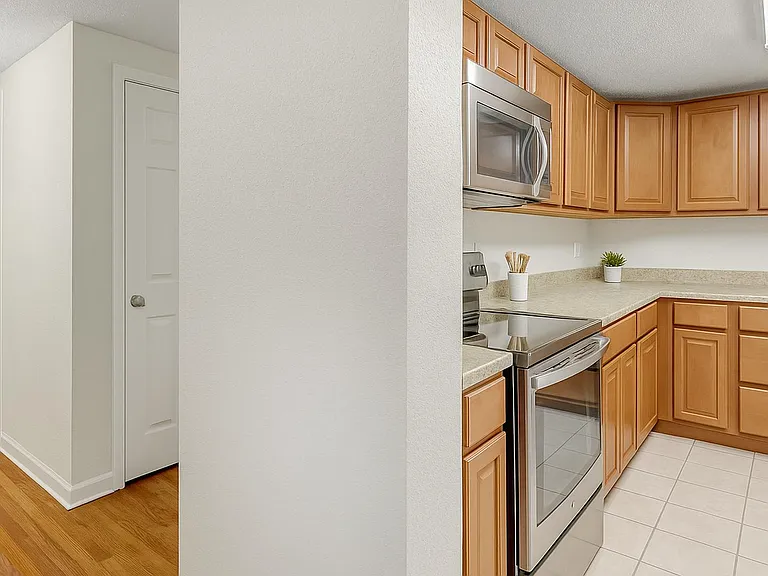 Practical shared kitchen and dining space with a warm, easy feel