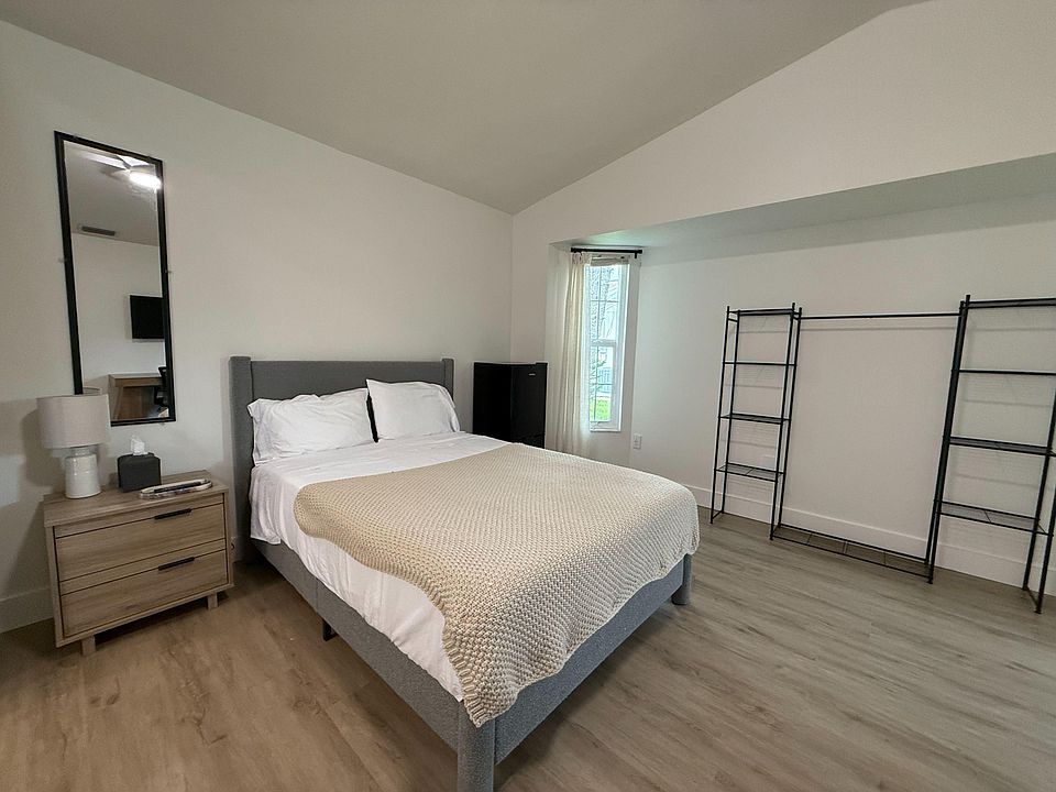 pop up closet, desk/ desk chair, one night stand, blind/ curtains