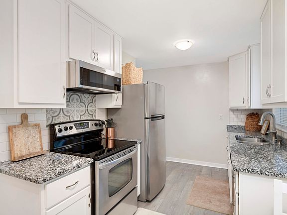 Kitchen with stainless steel applicances.