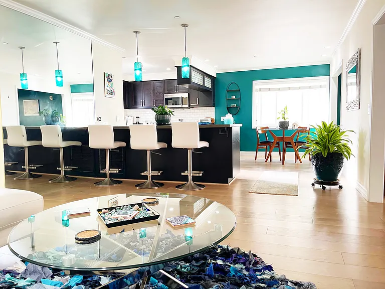 Open concept kitchen equipped with all new stainless steel appliances, breakfast nook, Living room