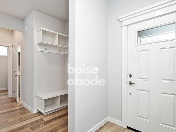 The mudroom is located around the corner from the front door.