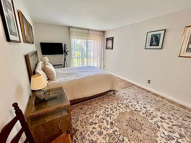Bedroom1 - Ethan allen Queen bed and end tables - as stated all furniture and art can be removed with reasonable lead time request.