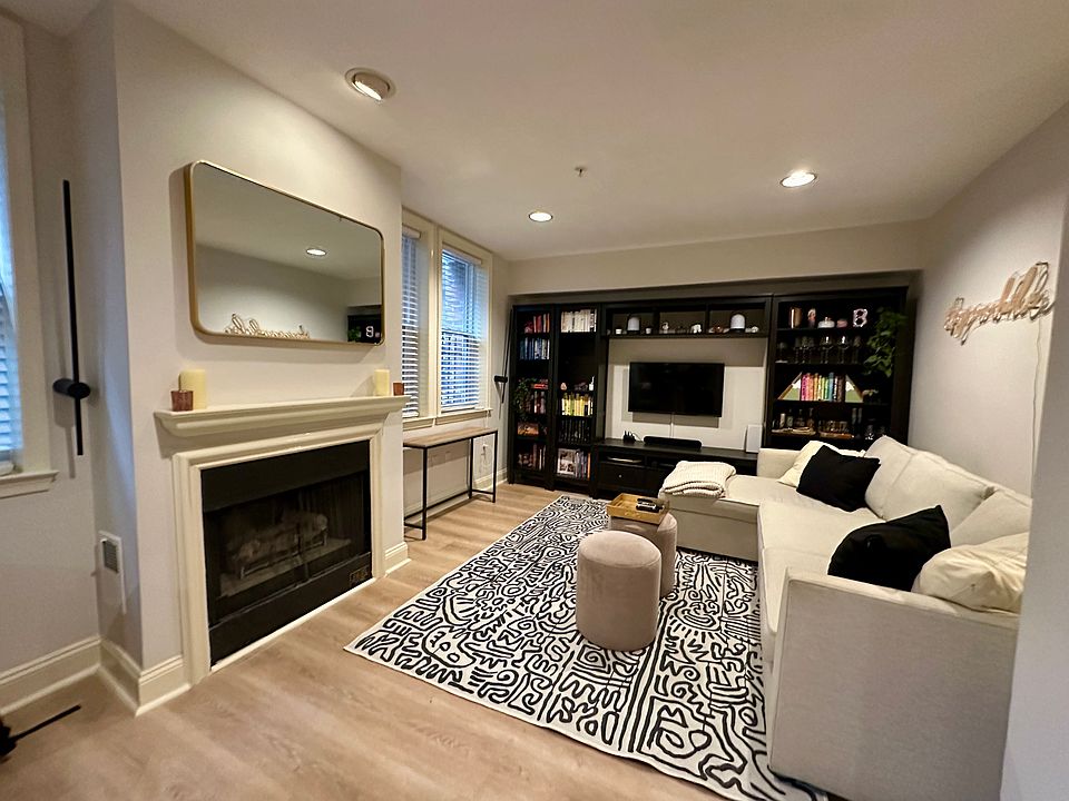 Large 12'x 23' Living/Dining area on first level with 8' ceilings. Gas Fireplace, HWD floors