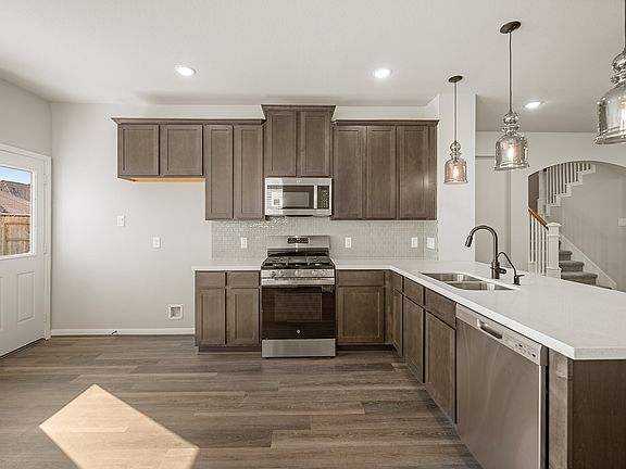 Kitchen with peninsula and pendant lighting