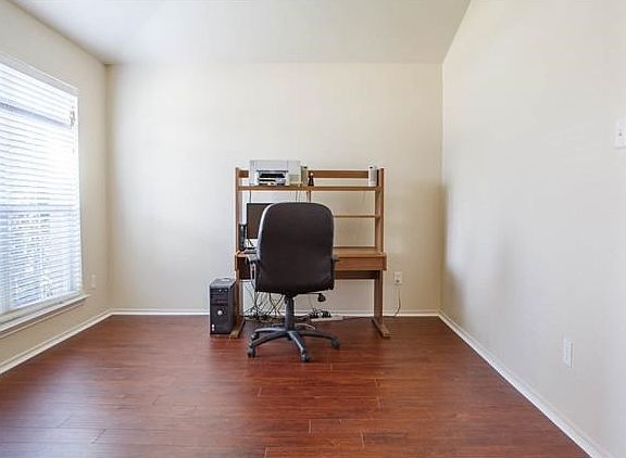 Formal dining at entrance also makes a great office.