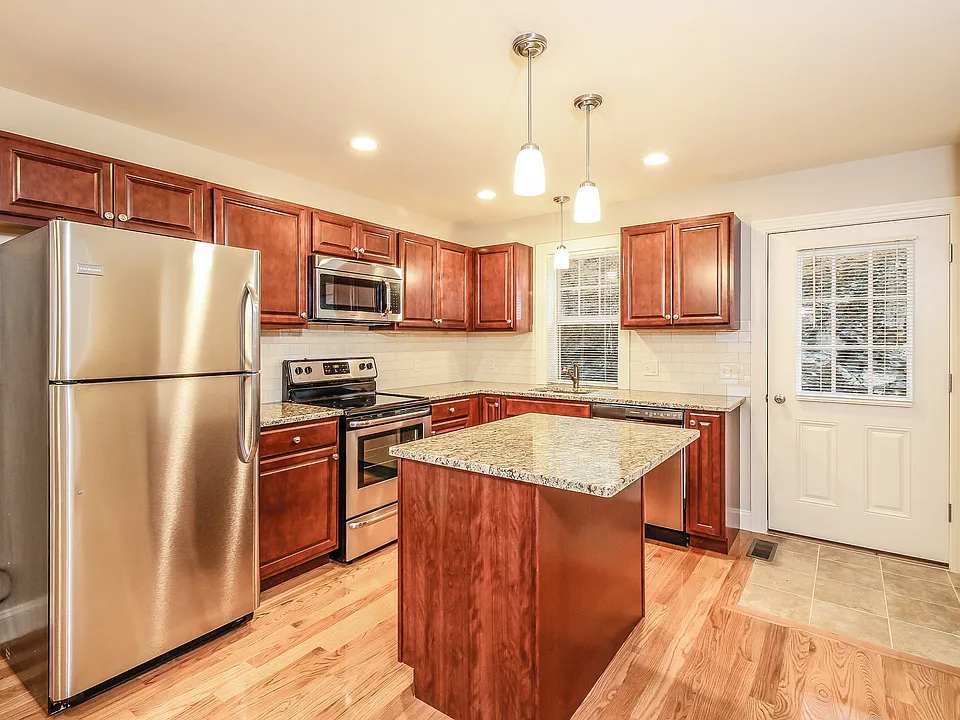 Maple wood cabinets, granite countertops and stainless steel appliances.