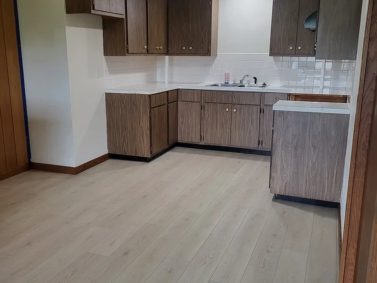 Kitchen remodel in the works. New recessed lighting and ceiling fan, new flooring in the combined kitchen and dining area, and new stove. Hood fan. Coming soon: Updated stainless appliances and new faucet.