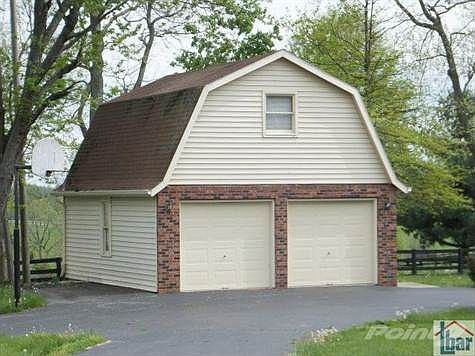Two story, two car detached garage. Actually put your vehicles in it and use the second floor as a "man cave."