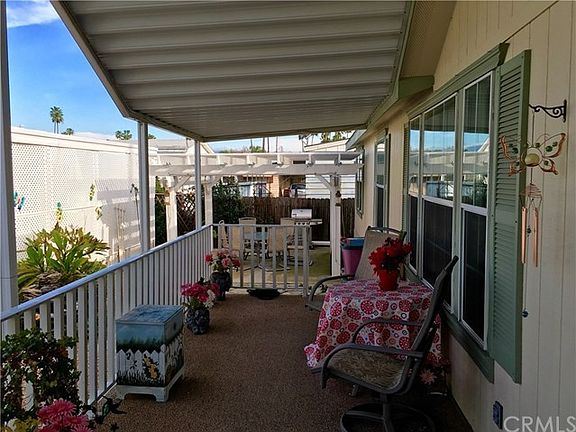 Large attached patio as well as spacious entertaining area in the yard.