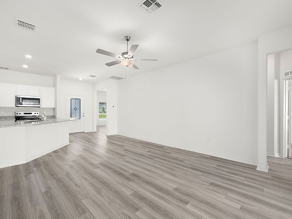 Spacious family room with vinyl flooring