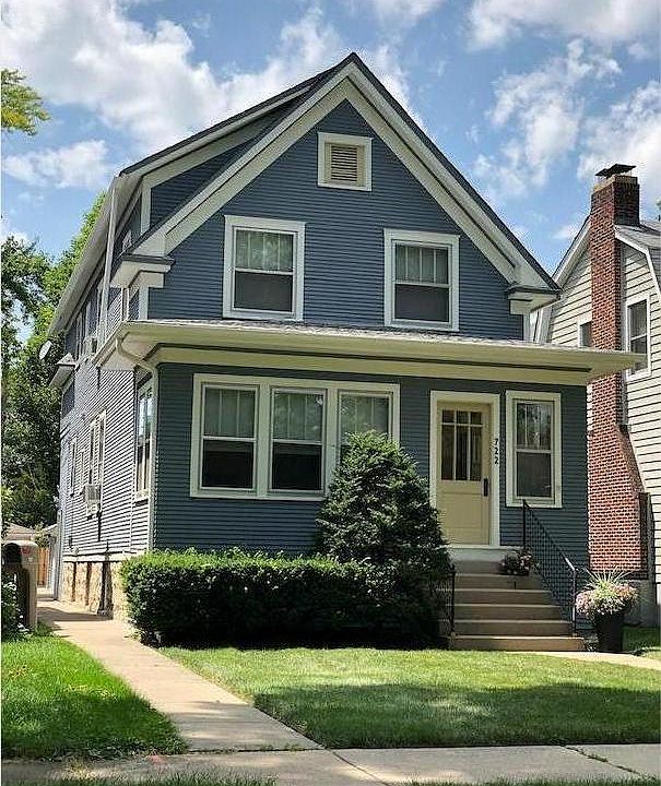 Two-flat that looks like a single family vintage farmhouse.