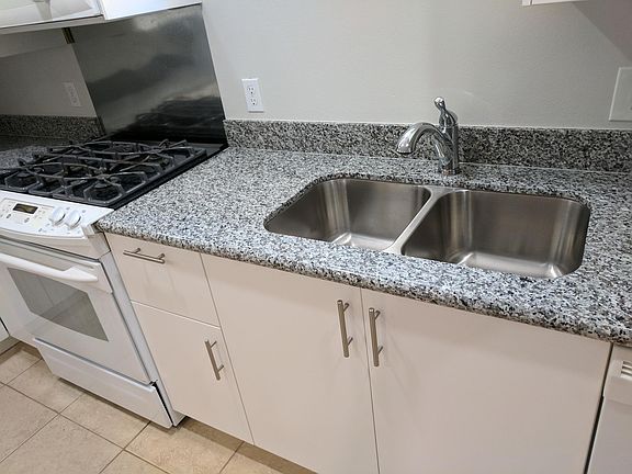 New granite counter tops, new under mount sink, new pull out