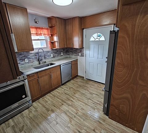 Kitchen that leads to fenced in back yard