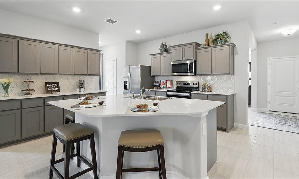 Kitchen-MLS Photos:All Home and community information, including pricing, included features, terms, availability and amenities, are subject to change at any time without notice or obligation. All Drawings, pictures, photographs, video, square footages, floor plans, elevations, features, colors and sizes are approximate for illustration purposes only and will vary from the homes as built.