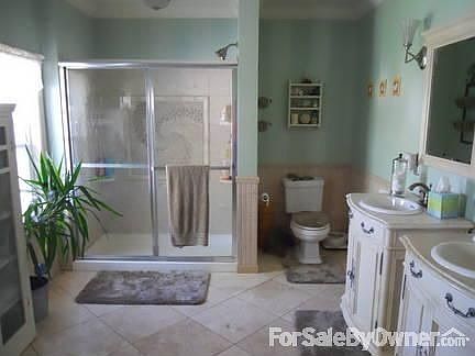 Upstairs bath
						:
						New in 2007. Oversized travertine tiles, marble shower surround, Jacuzzi tub.