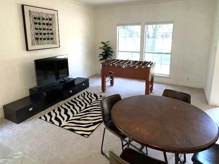 Seating for four plus entertainment options including an LED TV, Roku for streaming, fusbol!