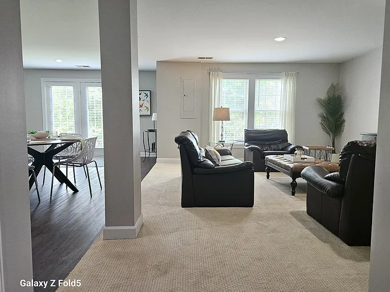 The wide hallway opens up to a natural light filled family room and kitchen area that is incredibly spacious.