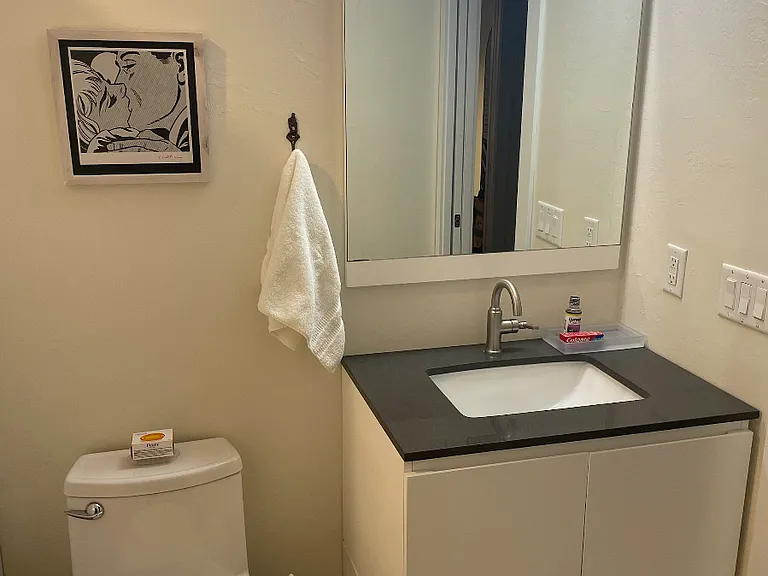 Bathroom vanity area w/ extra washstand storage