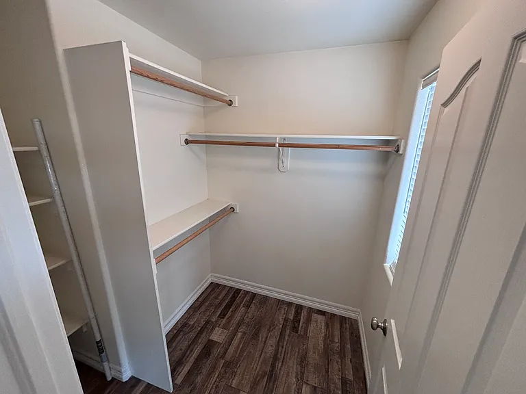 Walk-in closet with window.