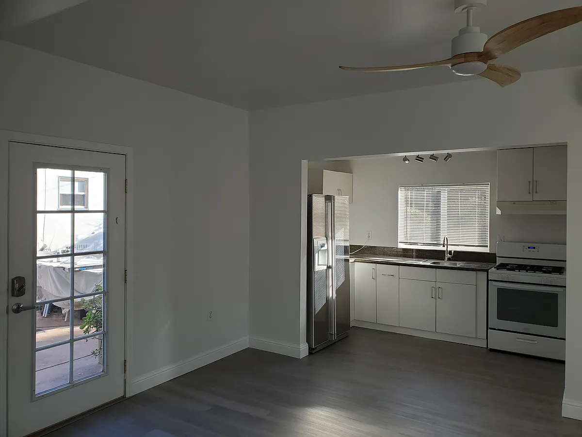 French door entrance and kitchen view. - 4820 7th Ave