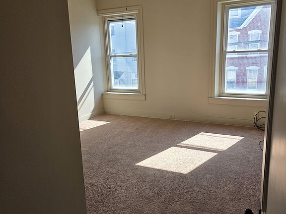 Larger of the two bedrooms with large closet and ceiling fan.