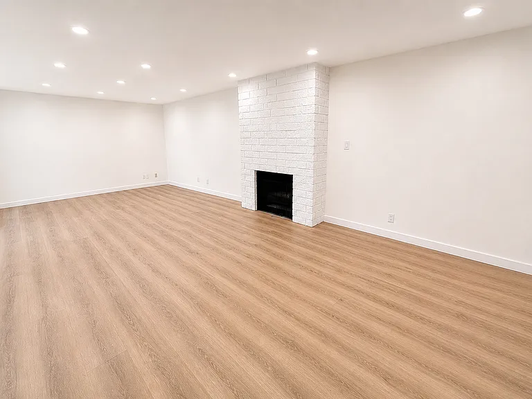 1 bedroom enormous living room with recessed can lighting throughout and gas fireplace!