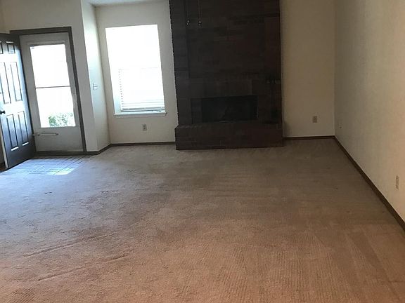 Cozy wood burning fireplace.