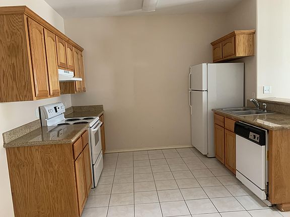 View of Kitchen with refrigerator, dishwasher and stove
