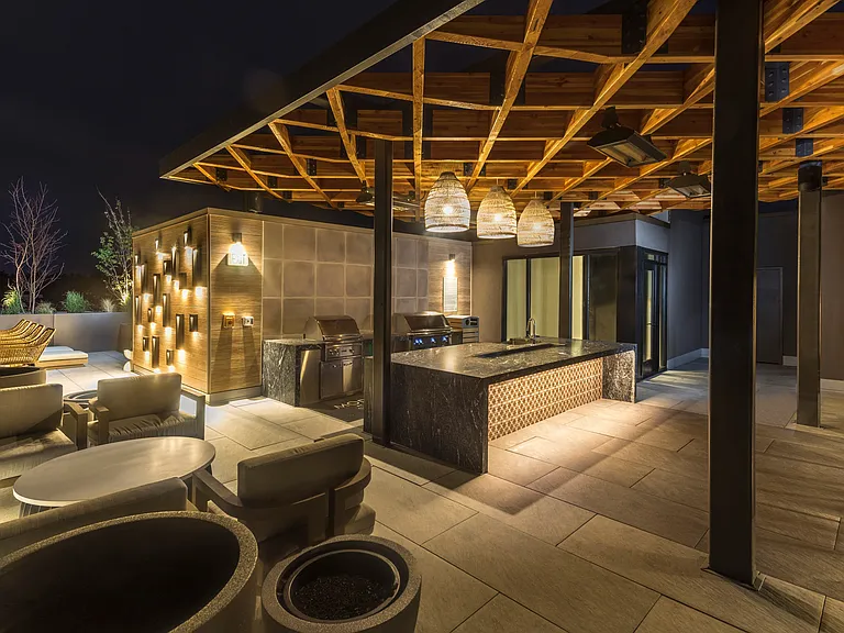Outdoor kitchen with grilling stations and gathering space