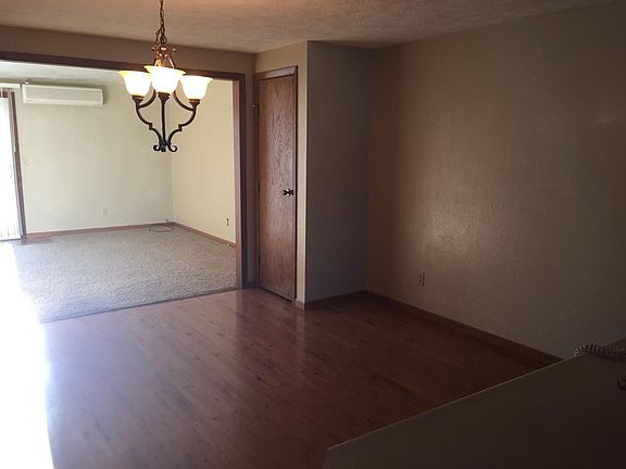 Large dining room with wood floors.