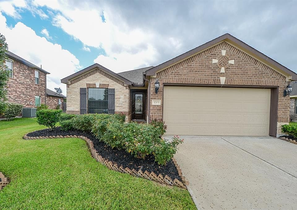 Welcome home to 3203 Southern Green Drive - note the beautifully landscaped grounds This house has tremendous curb appeal.