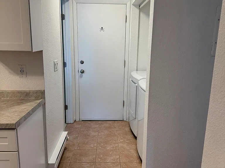 Hallway to Bathroom and Washer/Dryer and Rear Door