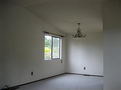 View of Dining room from living room. Vaulted ceiling!