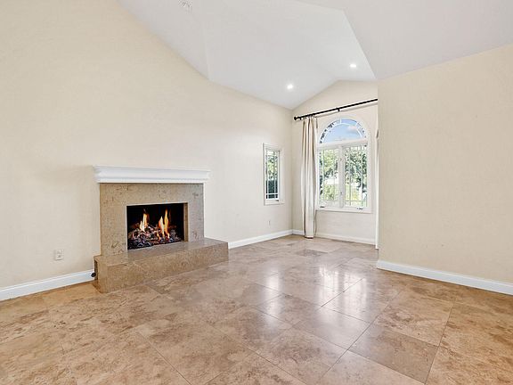 Formal living room with fireplace.