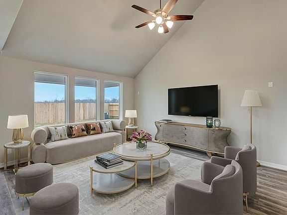 Family room with vaulted ceilings. Note Sample product photo - actual exterior and interior selecti
