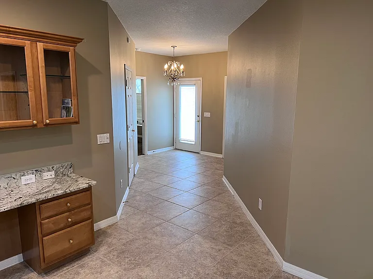Front entry way with entrance to den/3rd possible bedroom