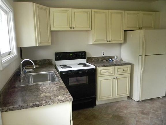 New cabinets, counters, sink and floor
