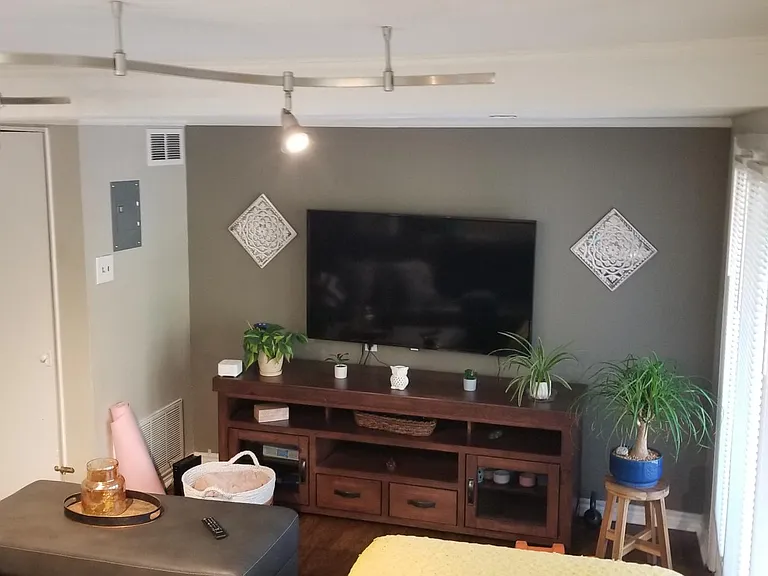 Front room (Rm #1) as decorated by previous tenant. Lighting and flooring has changed. This view is from as you walk in the front door and look right. *Apartment is unfurnished.